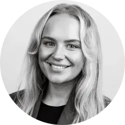 Amy Butcher. Amy is a young white woman with long blonde hair. She is wearing a dark top and jacket.