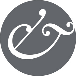 A white ampersand in a grey roundel. This team member has requested that we do not share their face online.