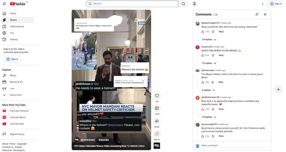 YouTube short film shows Mayor Mamdani in a hall way in a civic building looking at a phone. Critical messages are overlayed on the screen. A panel of comments on the video to the right show supportive comments on his positive reaction to valid criticism.