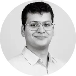 Jonah Danziger. Jonah is a young white man with short dark hair and glasses. He is wearing a light collared shirt.
