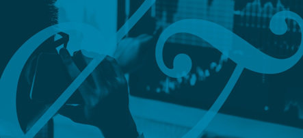 Image shows a financial trader looking at a screen while on the telephone. A Bowen Craggs ampersand is overlaid over the top. The image has a teal tint.