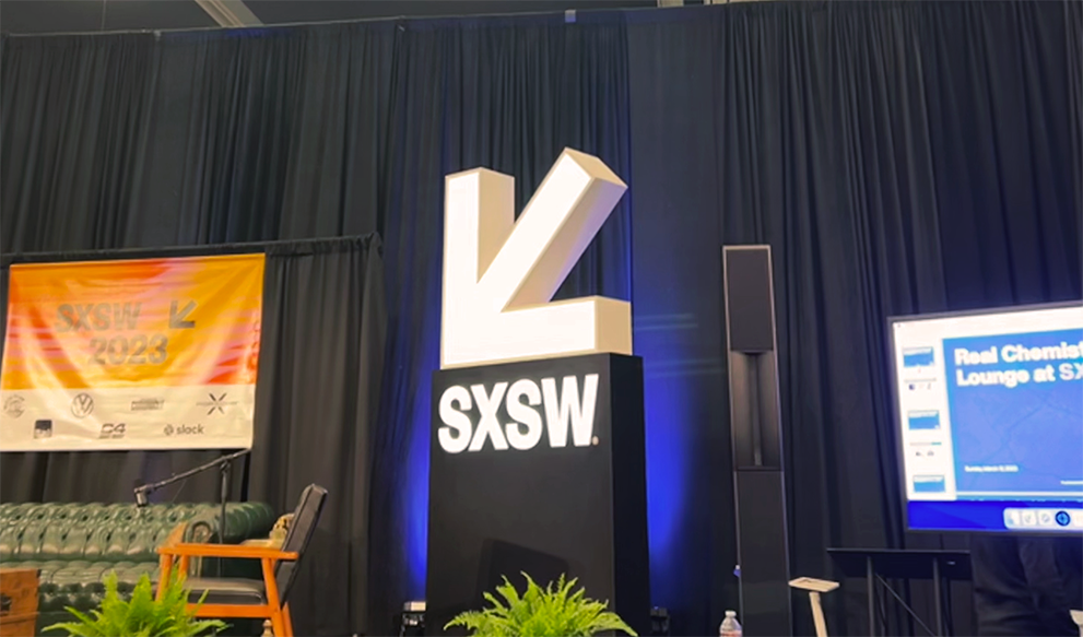 Panel stage with life-size SXSW logo