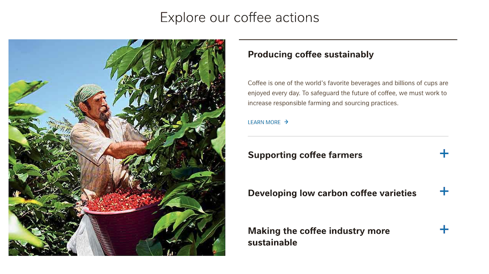 Screenshot of the 'Explore our Coffee actions' panel in Nestle Brands section. Image to the left of the screenshot shows a bearded white man wearing a bandana on his head surrounded by green foliage as he picks coffee beans, a bowl of red beans in front of him. The the left is a panel of text and links with the headings: Producing coffee sustainably, Supporting coffee farmers, Developing low carbon coffee varieties, and Making the coffee industry more sustainable.